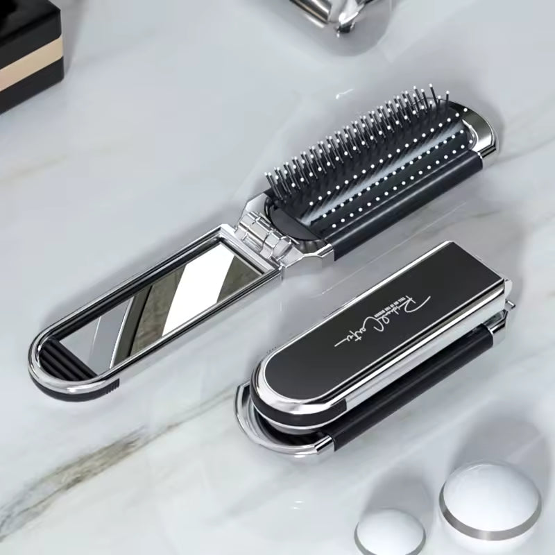 Compact hairbrush with integrated mirror