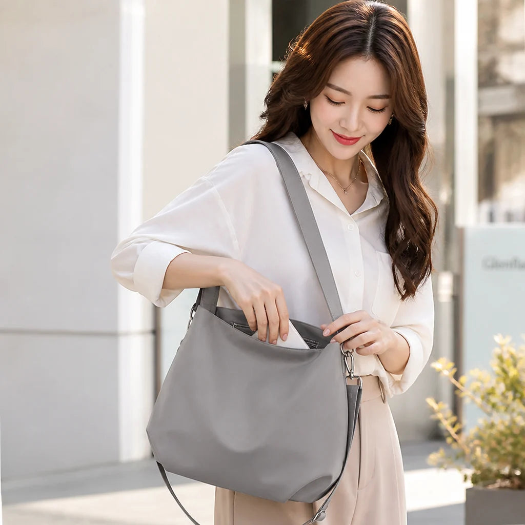 Waterproof nylon shoulder bag with multiple compartments