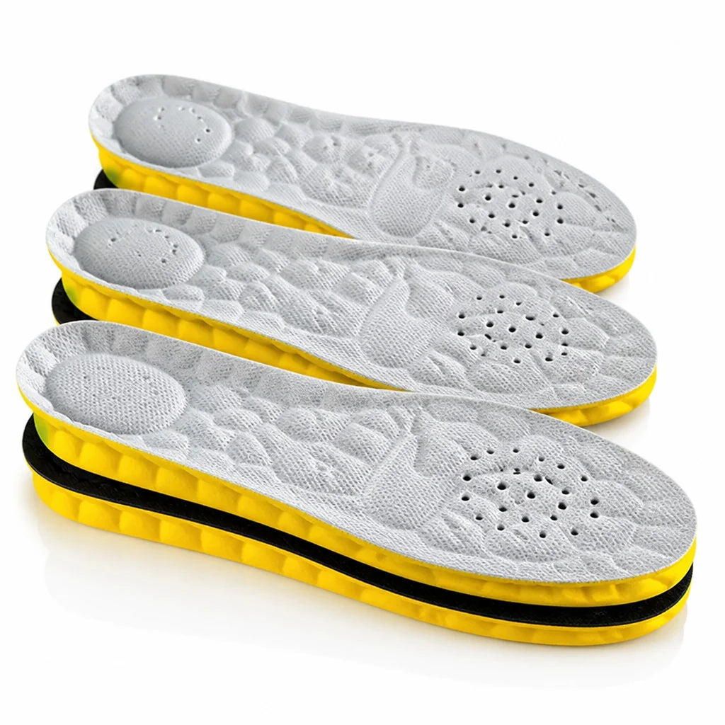 Shock-absorbing, perforated insoles with arch support