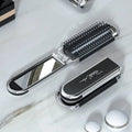Compact Hairbrush with Integrated Mirror