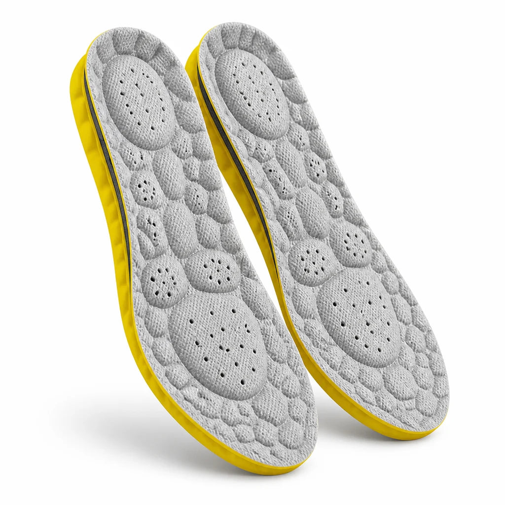 Shock-absorbing, perforated insoles with arch support